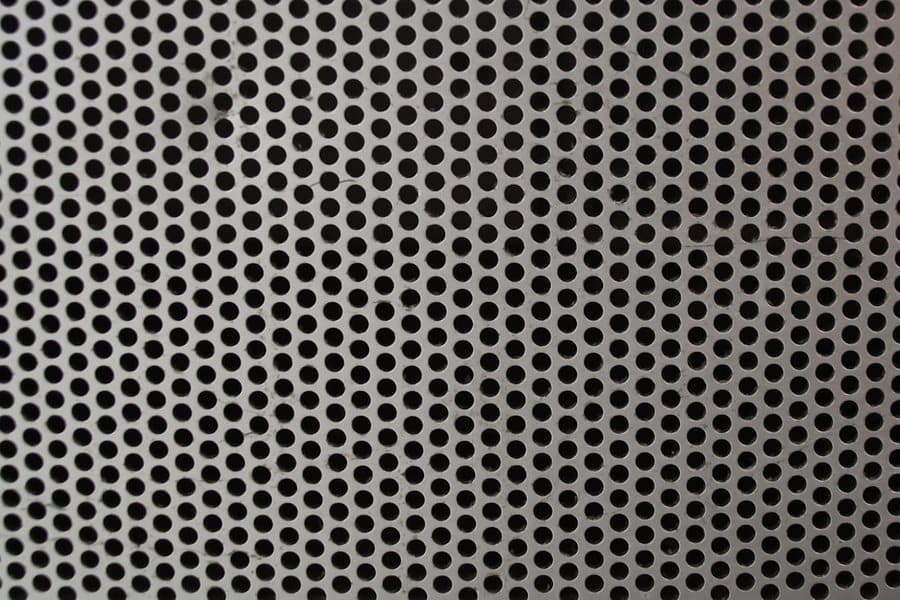 Finished perforated metal panel with a regular hole pattern