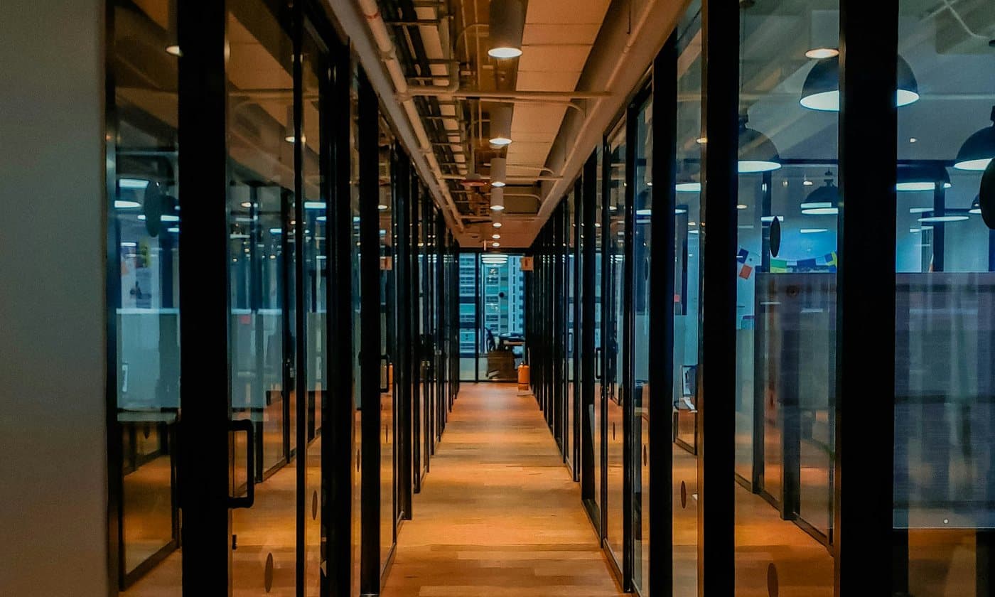 Glazed office corridor with a timber floor