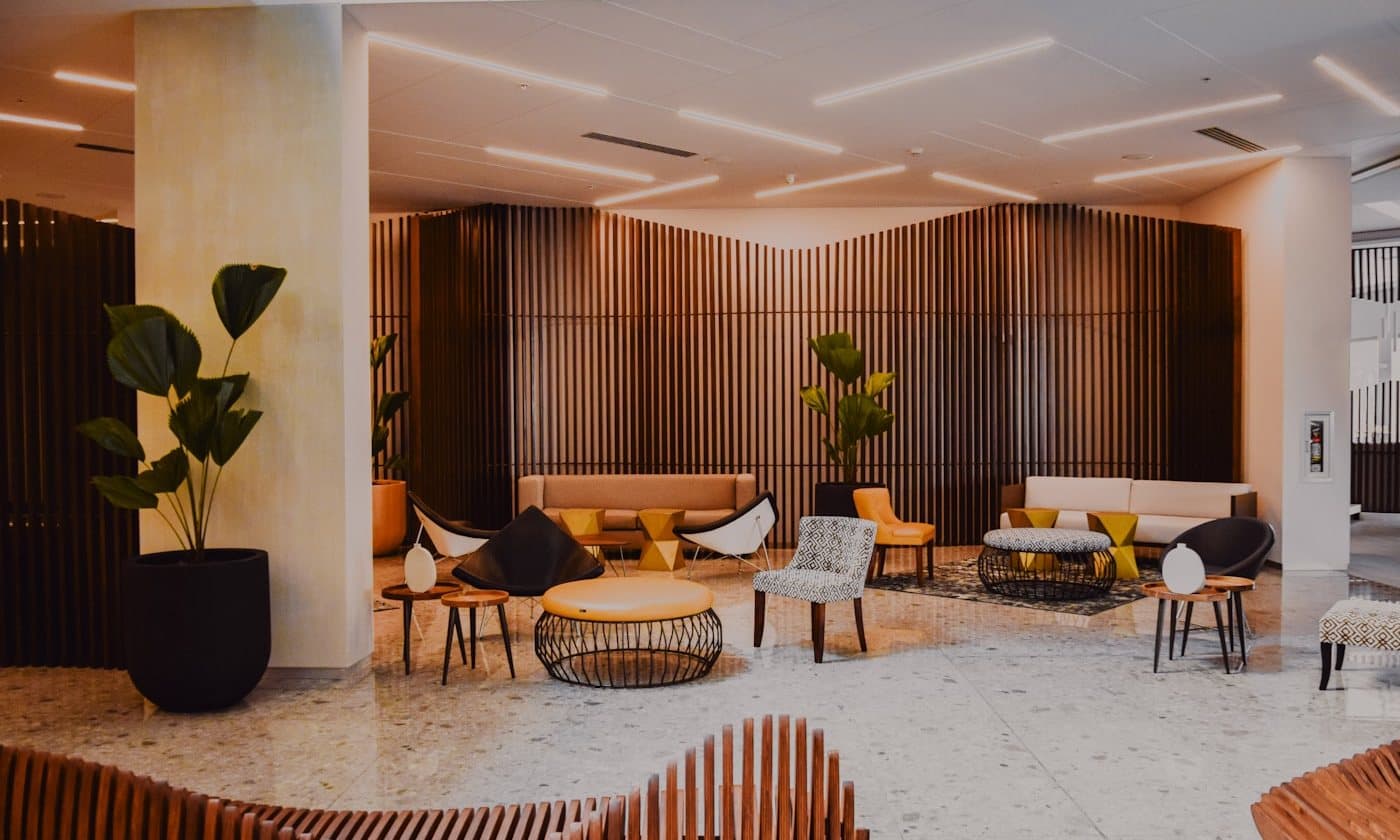Corporate lounge lined with vertical timber screens