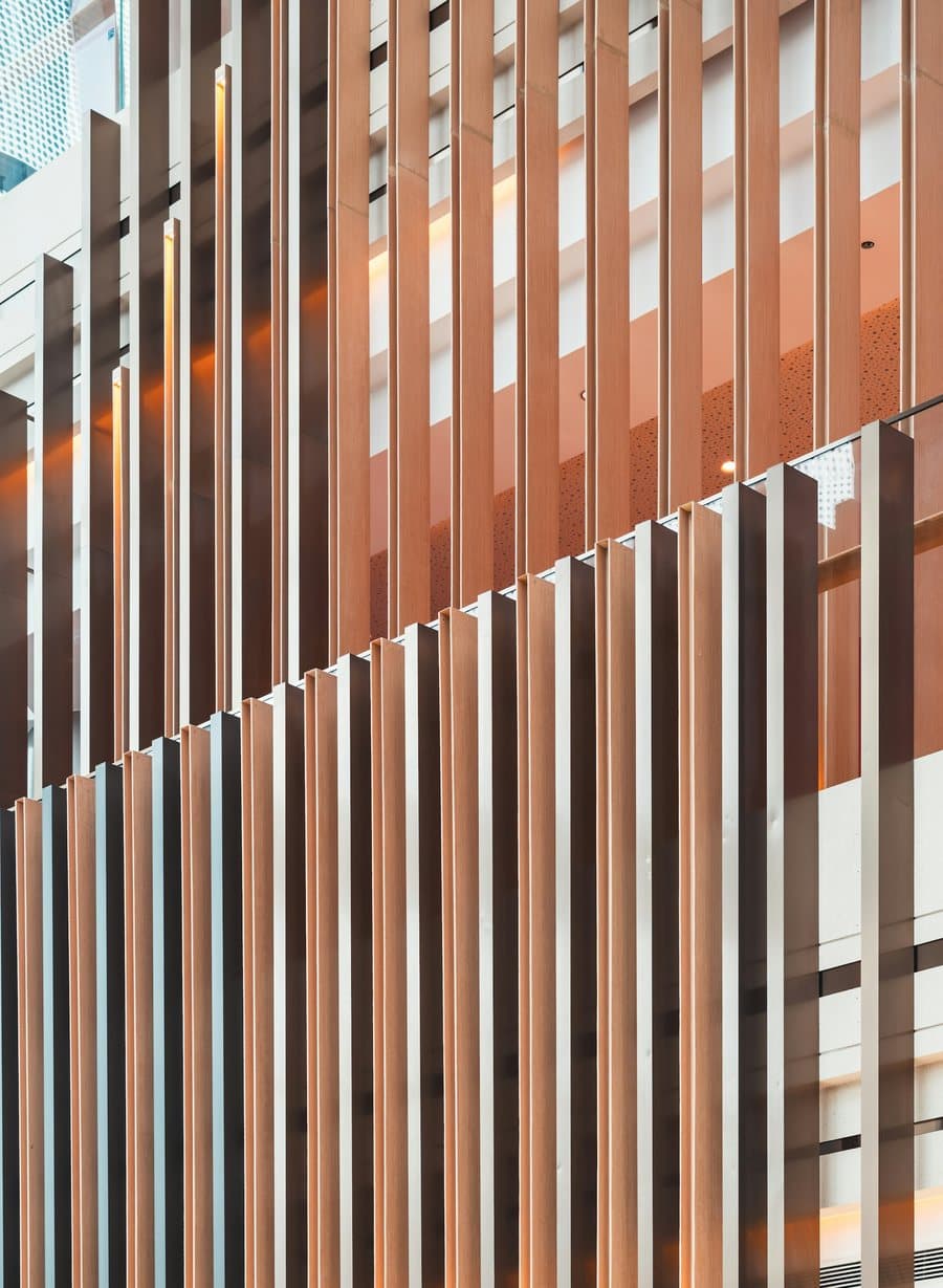 Copper-toned vertical slats running across a building facade