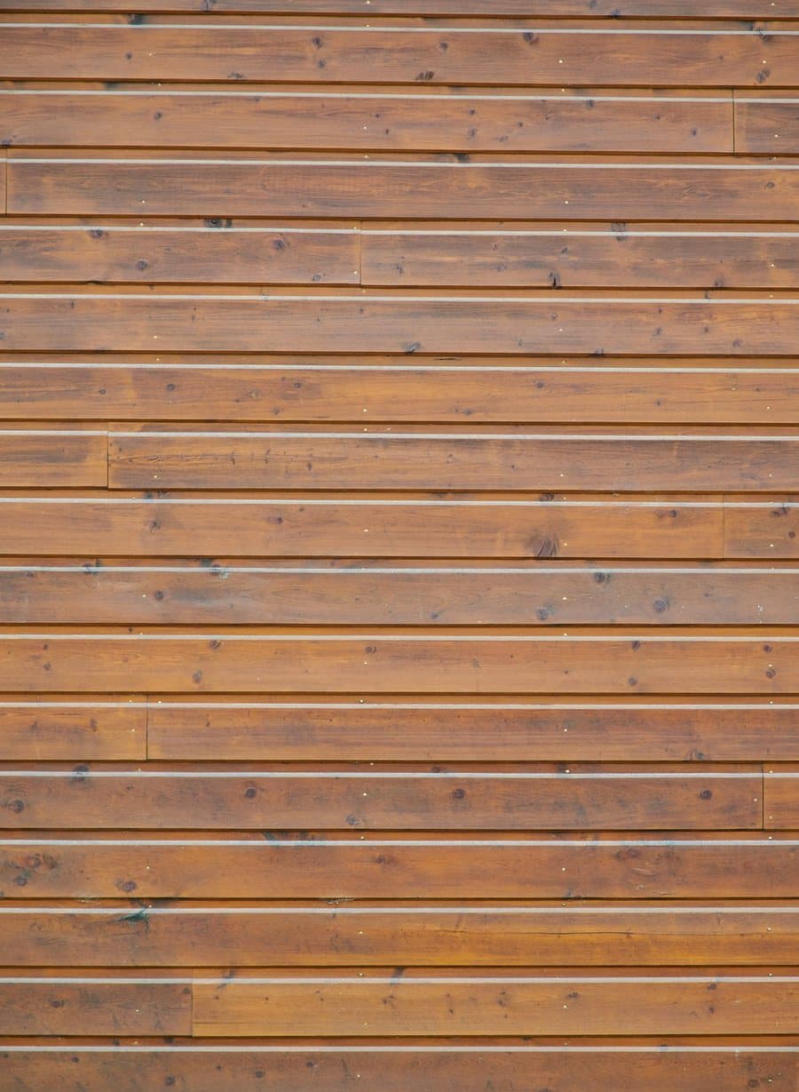 Horizontal timber plank wall in warm daylight